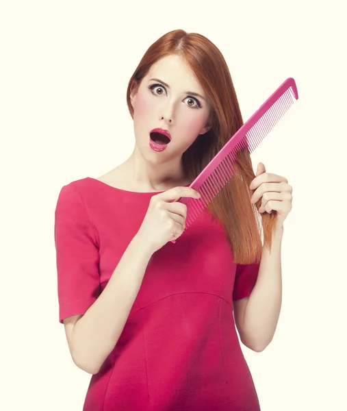 Funny redhead girl with big comb. — Stock Photo, Image