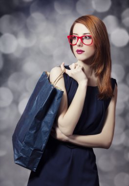 alışveriş torbaları ile stil Kızıl saçlı kız.
