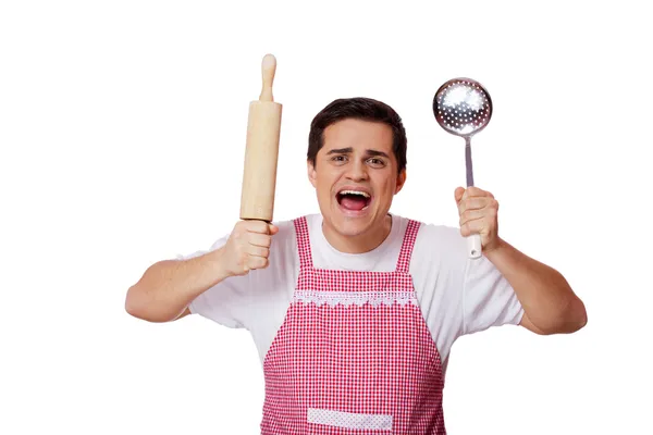 Cozinheiro com utensílios de cozinha sobre fundo branco — Fotografia de Stock