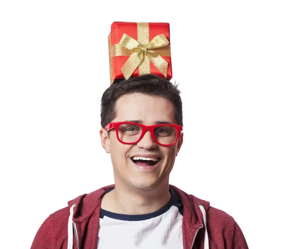 A man with present box on the head, white background. — Stock Photo, Image