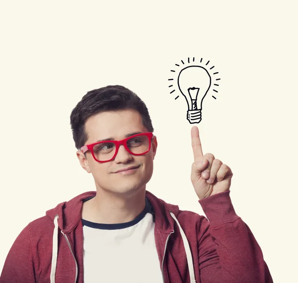 Young men hold finger on abstract idea lamp. — Stock Photo, Image