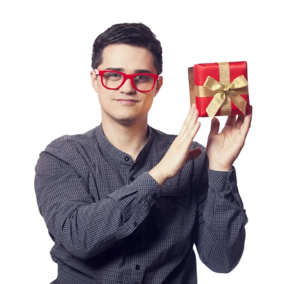 Young man holding red gift — Stock Photo, Image