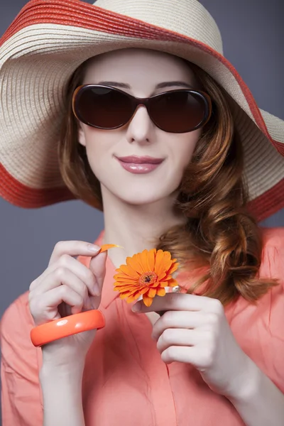 Beautiful red-haired girl in hat at white background — Stock Photo, Image