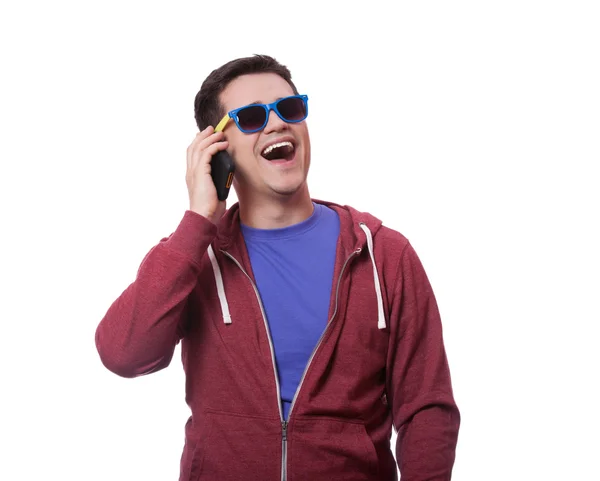 Joven de estilo en gafas de sol con móvil — Foto de Stock