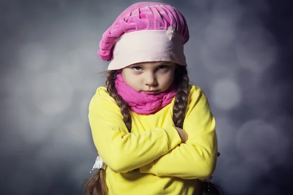 Close-up portrait of adorable sad child girl wearing pink knitte — Stock Photo, Image