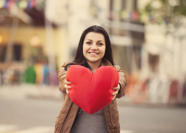 Teen girl with heart at outdoor. Royalty Free Stock Images