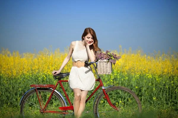 Girl on a bike in the countryside — Stock Photo, Image