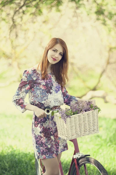 Girl on a bike in the countryside — Stock Photo, Image