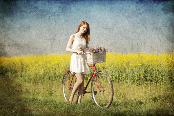 Girl on a bike in the countryside. — Stock Photo, Image