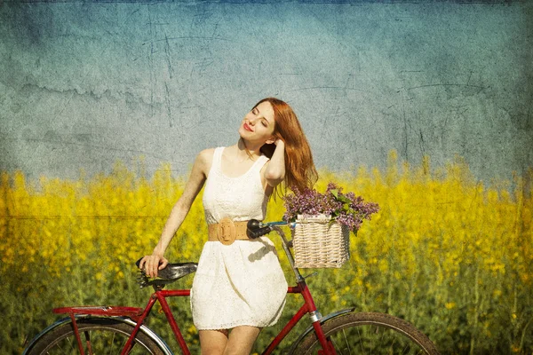 Girl on a bike in the countryside. — Stock Photo, Image