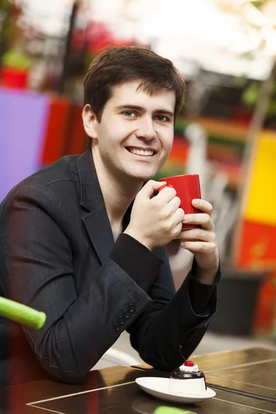 Style man with cup and cake — Stock Photo, Image