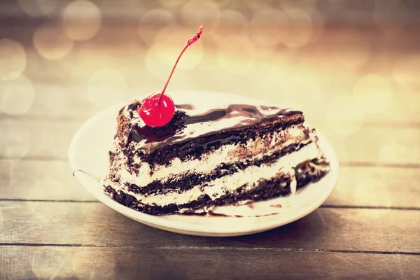 Cherry cake. Photo in old vintage color image style. Focus on ch — Stock Photo, Image