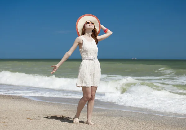 Redhead girl on the beack in spring time — Stock Photo, Image