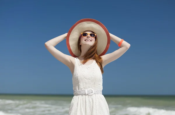 Redhead girl on the beack in spring time — Stock Photo, Image
