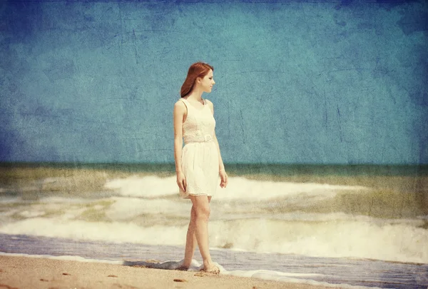 Redhead girl on the beack in spring time — Stock Photo, Image