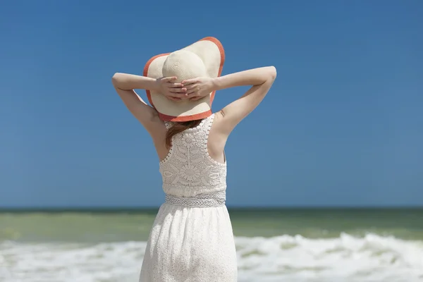 Redhead girl on the beack in spring time — Stock Photo, Image