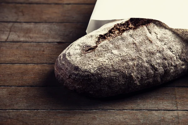 Delicious bread on a wood table — Stock Photo, Image