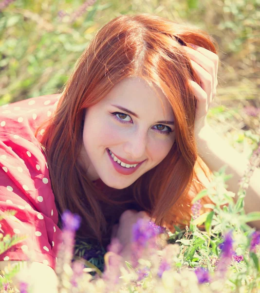 Redhead girl at green grass at village outdoor — Stock Photo, Image