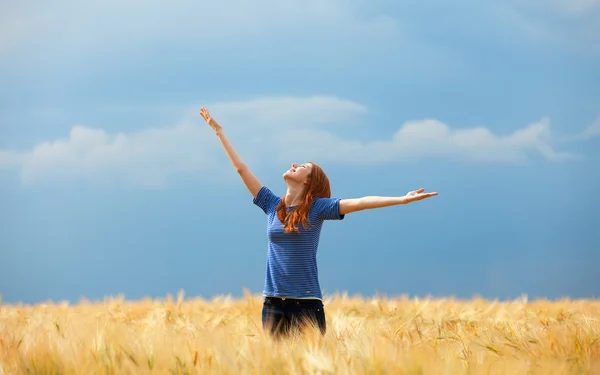 Redhead girl at field Stock Photo