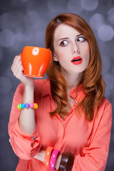 Redhead girl with cup. — Stock Photo, Image