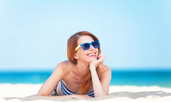 Redhead girl on the beach in spring time. — Stock Photo, Image