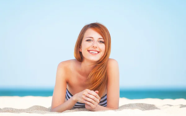 Redhead girl on the beach in spring time. — Stock Photo, Image