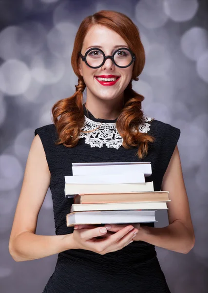 Menina sorridente com livros — Fotografia de Stock