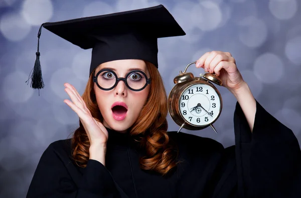 Redhead student with big clock — Stock Photo, Image