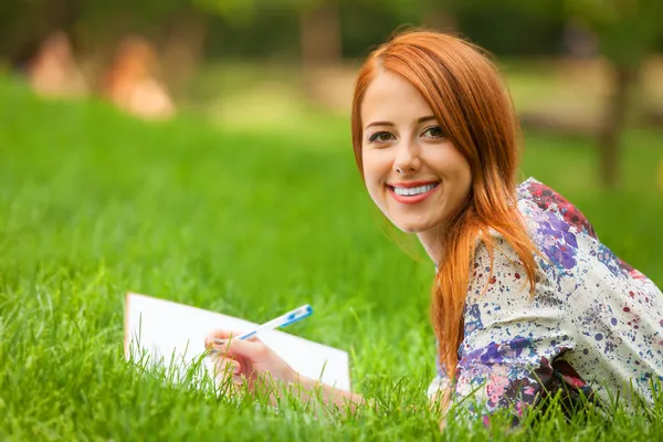 Beautiful young woman with note at outdoor Stock Photo