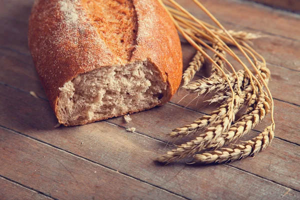 Delicious bread on a wood table — Stock Photo, Image