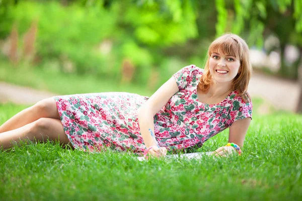 Young beautiful pregnant woman in the park Stock Picture