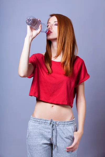 Sport woman with bottle. — Stock Photo, Image
