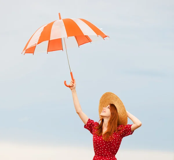 Ragazza rossa con ombrello — Foto Stock