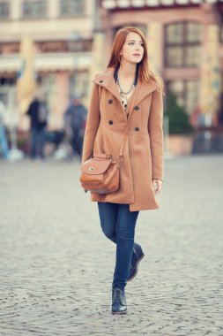 Redhead women walking on the street