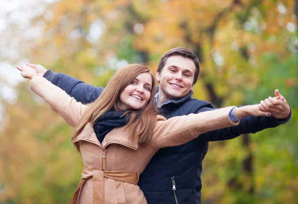 Teen couple in the autumn park — Stock Photo, Image