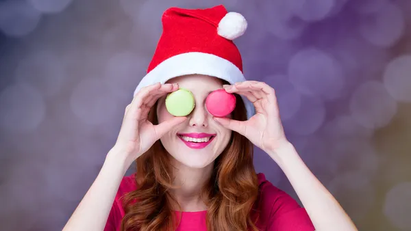 Redhead girl with macaron for Christmas — Stock Photo, Image