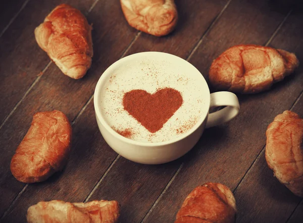 Cup of coffee with french croissant — Stock Photo, Image