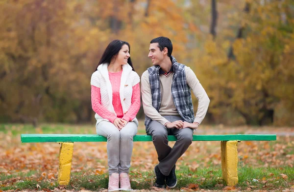 Couple at the park in autumn time — Stock Photo, Image