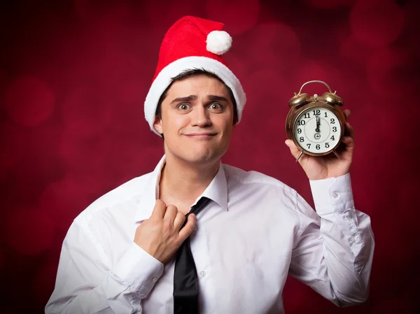 Handsome man with clock. — Stock Photo, Image