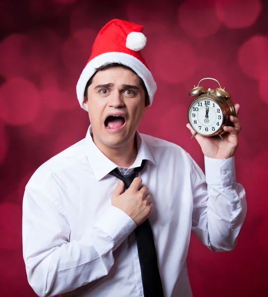 Handsome man with clock. — Stock Photo, Image
