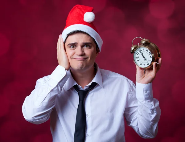 Handsome man with clock. — Stock Photo, Image