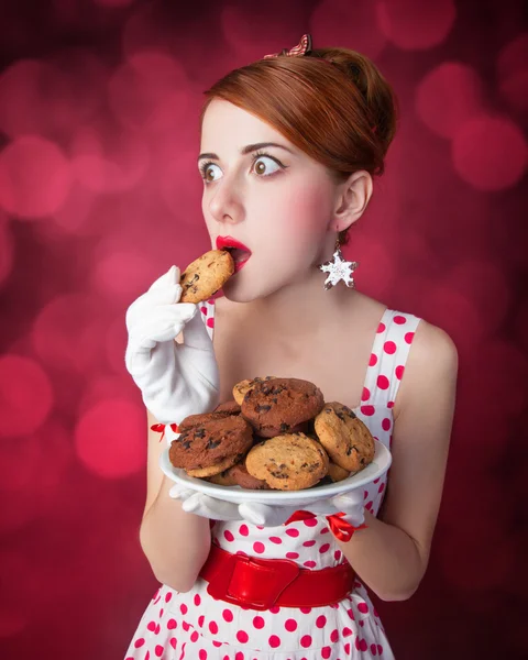 Belle donne rosse con coockie — Foto Stock