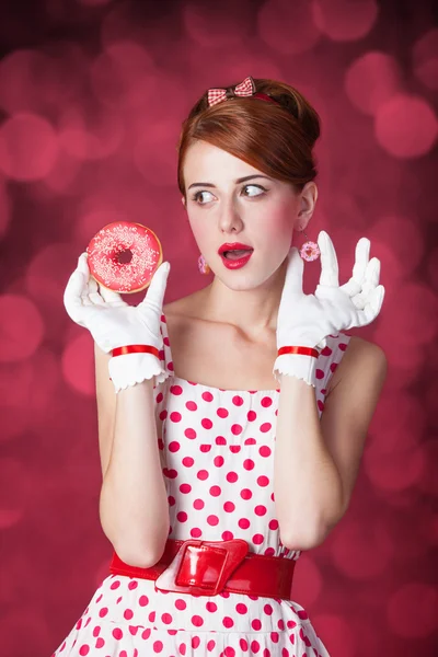 Beautiful redhead women with donut. — Stock Photo, Image