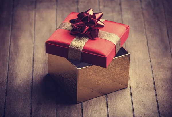 Christmas gift box on wooden table — Stock Photo, Image