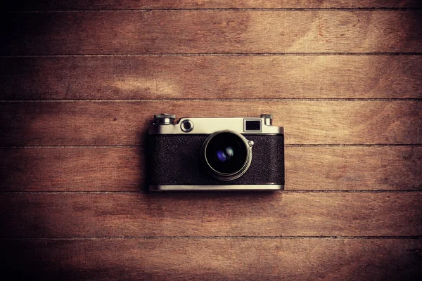 Vintage camera on a wooden background — Stock Photo, Image