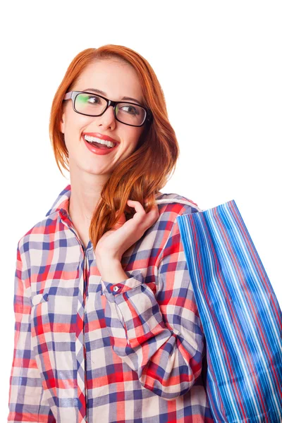 Ragazza rossa con shopping bag — Foto Stock