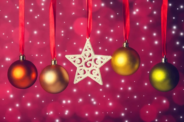 Christmas balls and star on ribbon — Stock Photo, Image