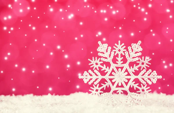 Snowflake on red background — Stock Photo, Image