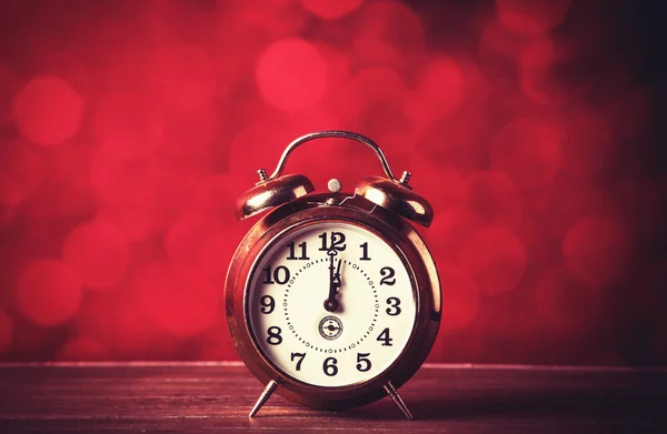 Retro alarm clock on table — Stock Photo, Image