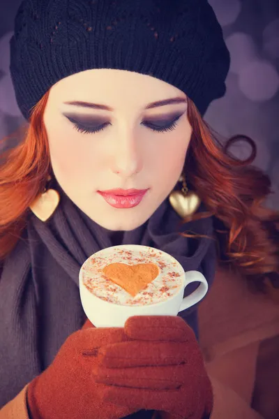 Redhead girl with red coffee cup. — Stock Photo, Image